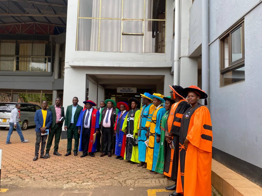 Makland Institute graduation ceremony with faculty and students outside the building